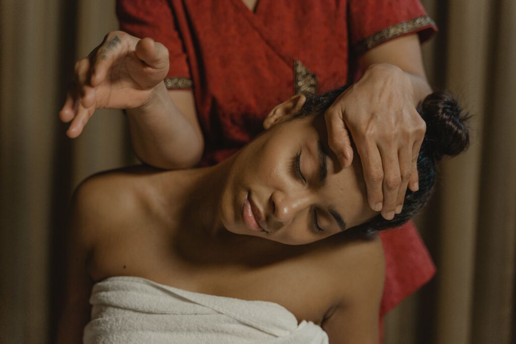 Kerala Wellness Practices: A Journey to Natural Health, Inner Peace, and Holistic Living A serene moment of a woman enjoying a soothing massage session for wellness and relaxation.